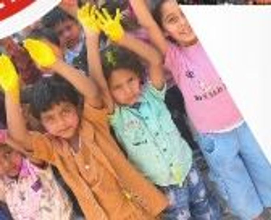 Smiling pupils raising their hands and joining in during a group activity at Sunrise Convent School