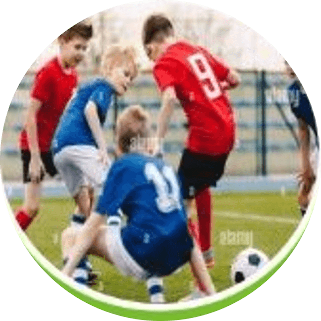 Children taking part in a football match on the school ground
